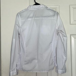 A white button down business casual shirt